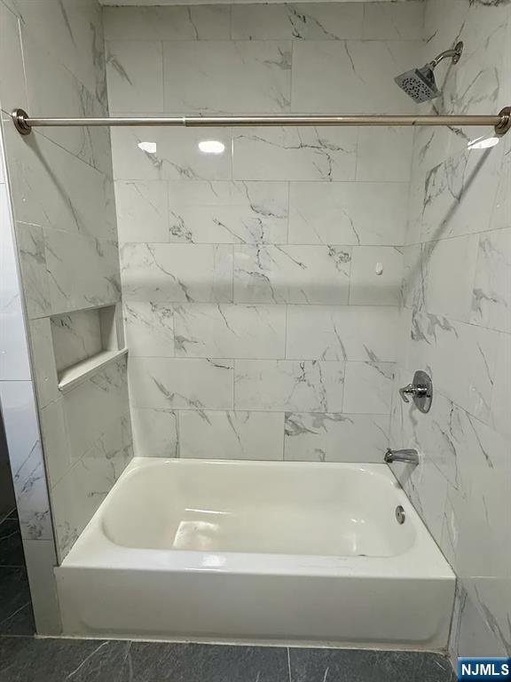 57 Maolis Avenue, Unit 2 Bloomfield, NJ 07003 - Photo 11 of 22 a bathroom with a bathtub
