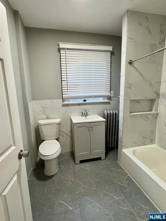 57 Maolis Avenue, Unit 2 Bloomfield, NJ 07003 - Photo 12 of 22 a view of a bathroom with a sink a toilet and bathtub
