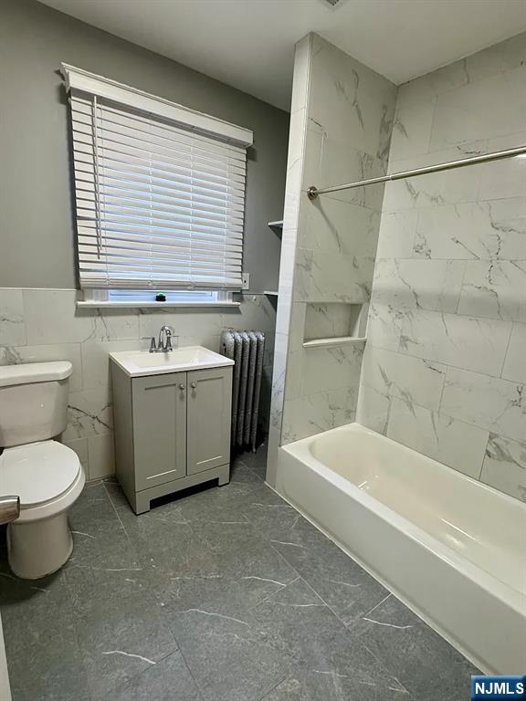 57 Maolis Avenue, Unit 2 Bloomfield, NJ 07003 - Photo 13 of 22 a bathroom with a sink toilet a bathtub and shower