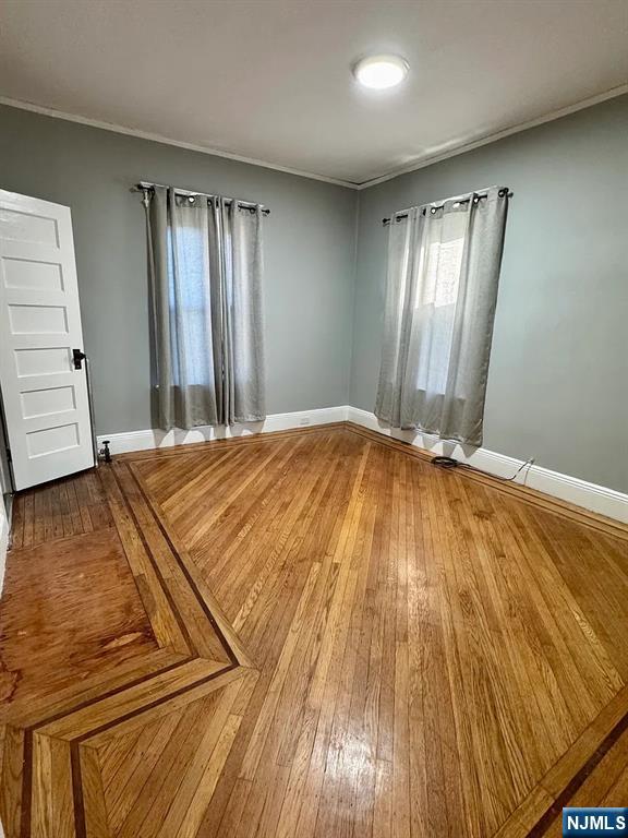 57 Maolis Avenue, Unit 2 Bloomfield, NJ 07003 - Photo 15 of 22 a bedroom with a bed and wooden floor
