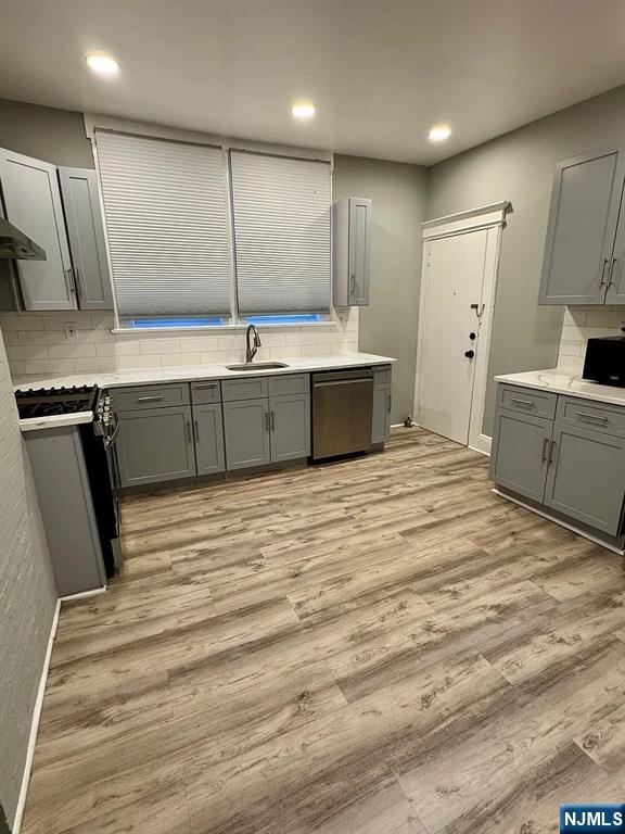 57 Maolis Avenue, Unit 2 Bloomfield, NJ 07003 - Photo 18 of 22 a large kitchen with a sink a refrigerator and a stove top oven