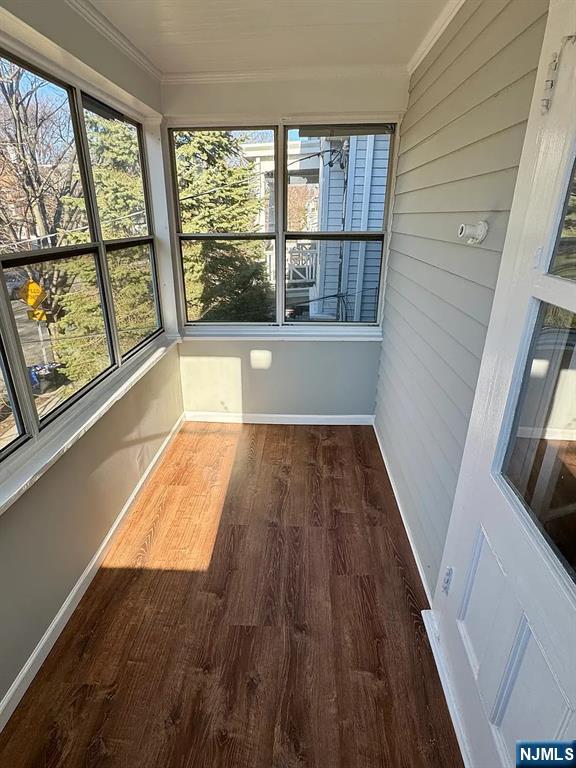 57 Maolis Avenue, Unit 2 Bloomfield, NJ 07003 - Photo 2 of 22 view of wooden floor with a window
