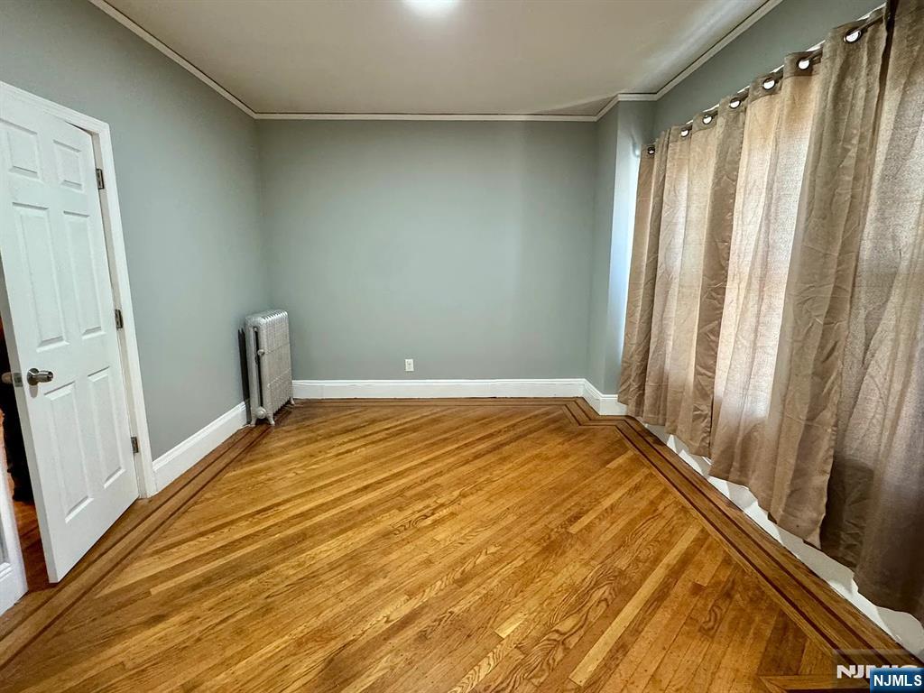 57 Maolis Avenue, Unit 2 Bloomfield, NJ 07003 - Photo 5 of 22 a view of a room with wooden floor and stairs