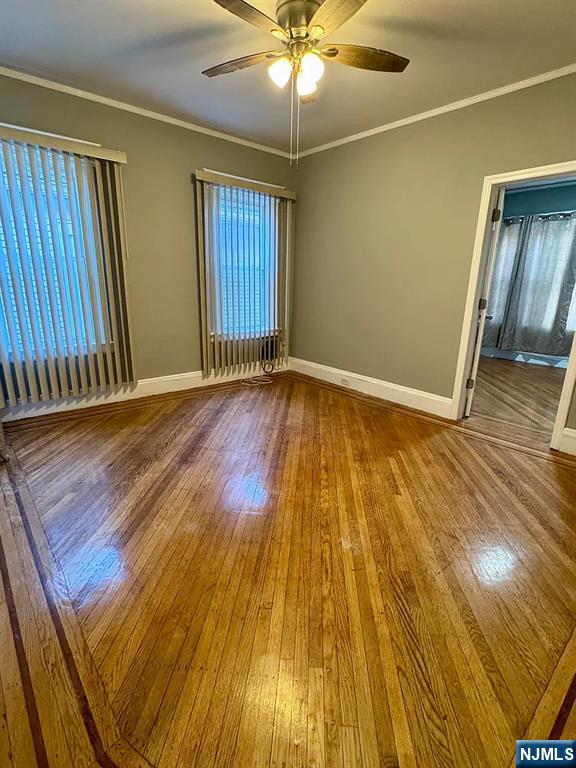 57 Maolis Avenue, Unit 2 Bloomfield, NJ 07003 - Photo 9 of 22 wooden floor in an empty room with a window