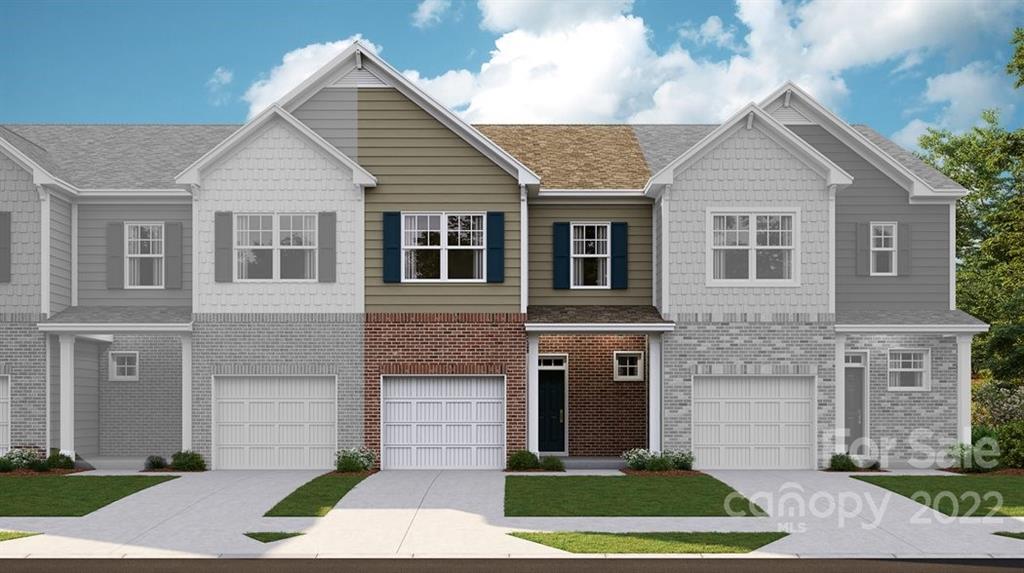 909 Pk Bnd Trail, Unit 64 Tega Cay, SC 29708 - Photo 1 of 3 a front view of a house with a yard