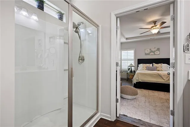 a bedroom with a bed and a painting on the wall