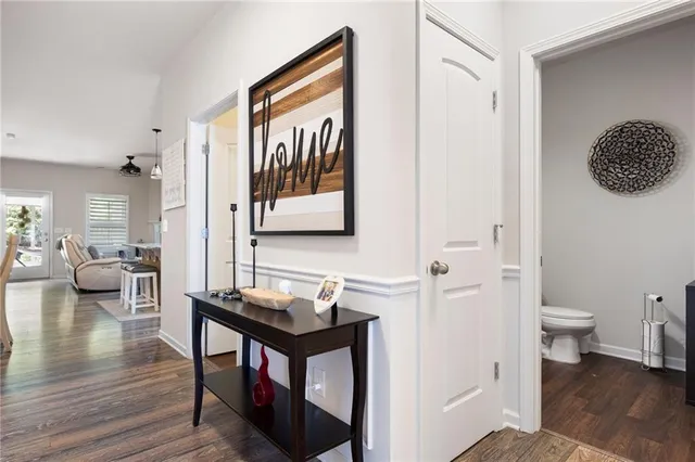 a bathroom with a toilet a sink and a mirror