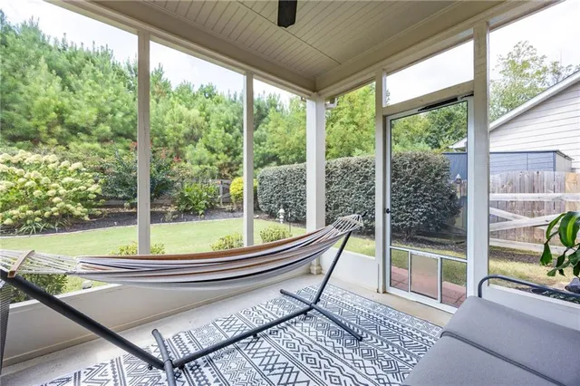 a living room with a large window and a table
