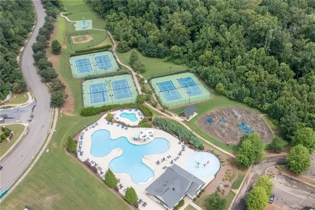 aerial view of a house with a yard