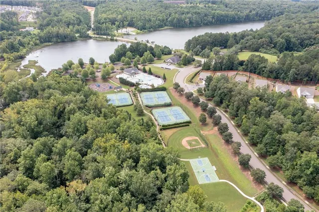 an aerial view of a house with a lake view