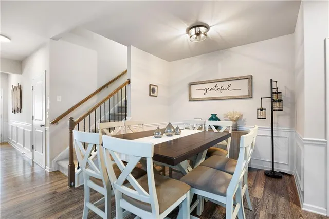 a view of a dining area with furniture and wooden floor