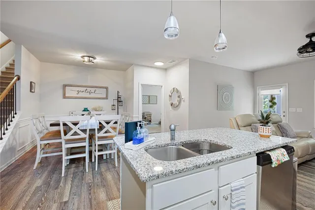 a kitchen that has a table and chairs in it