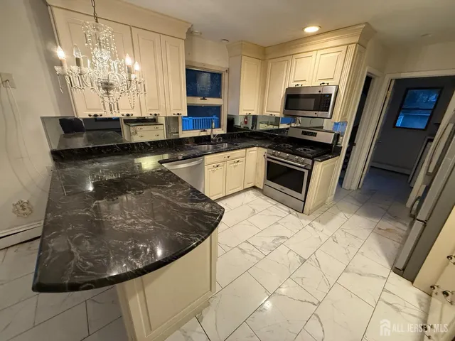 a big yard with lots of green space and deers