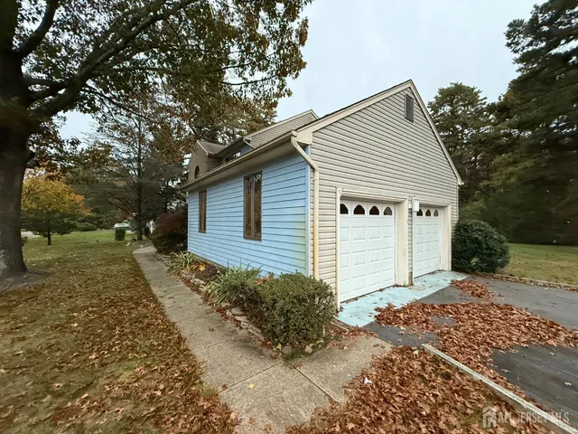 a view of entryway and hall with a front door