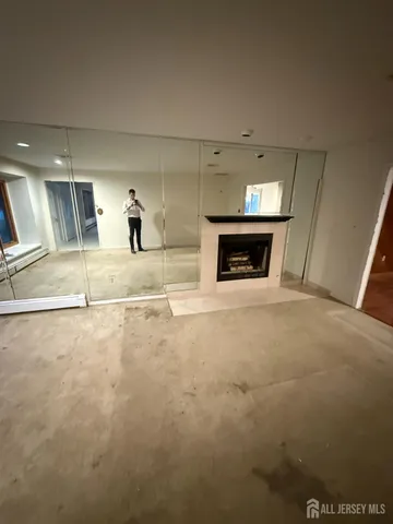a kitchen with granite countertop a sink a stove and cabinets