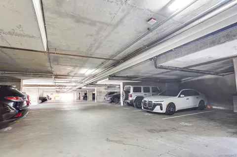a view of parking garage with cars