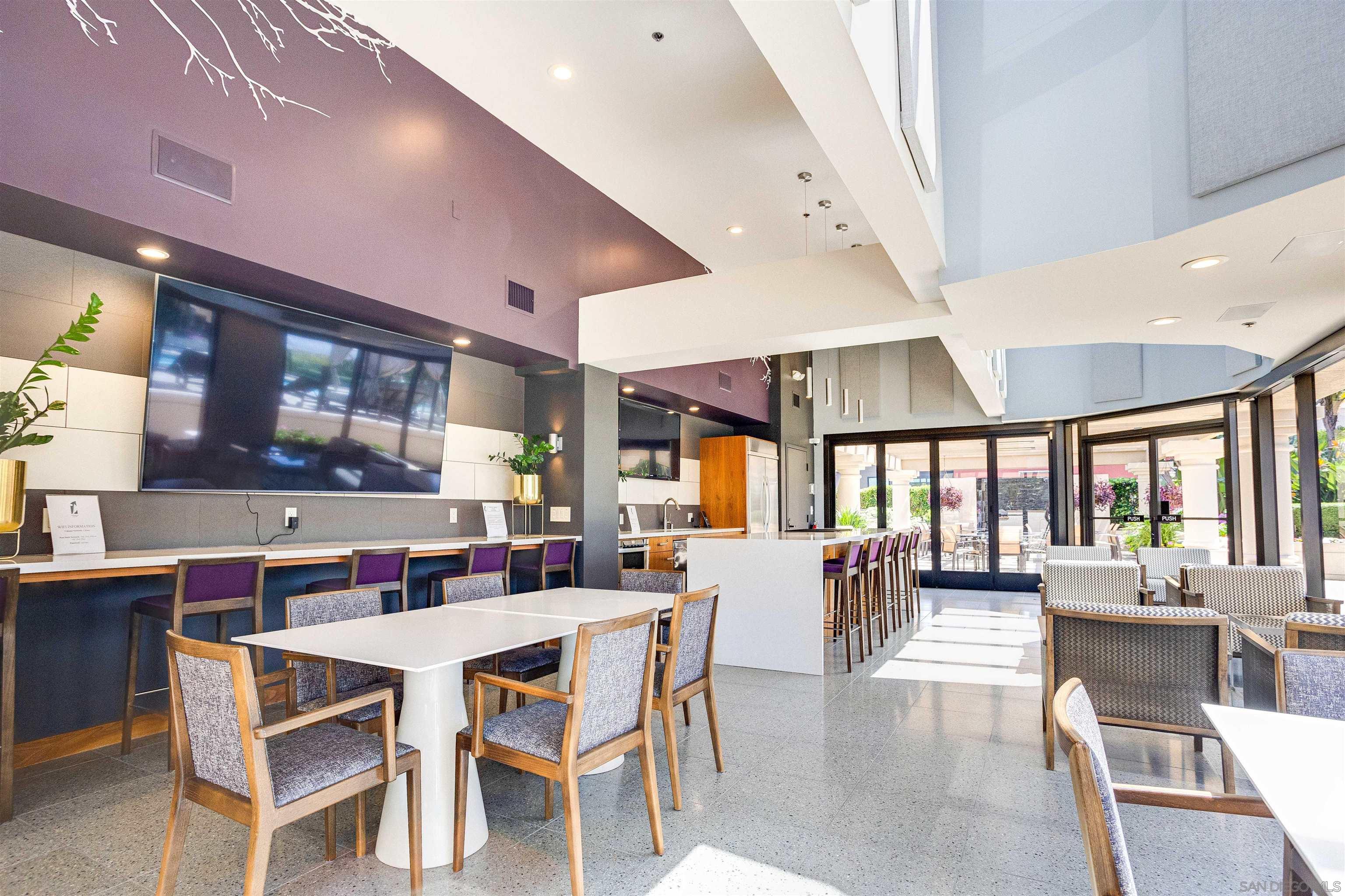 100 Harbor Drive, Unit 505 San Diego, CA 92101 - Photo 26 of 33 a dining room with stainless steel appliances kitchen island furniture and a large window