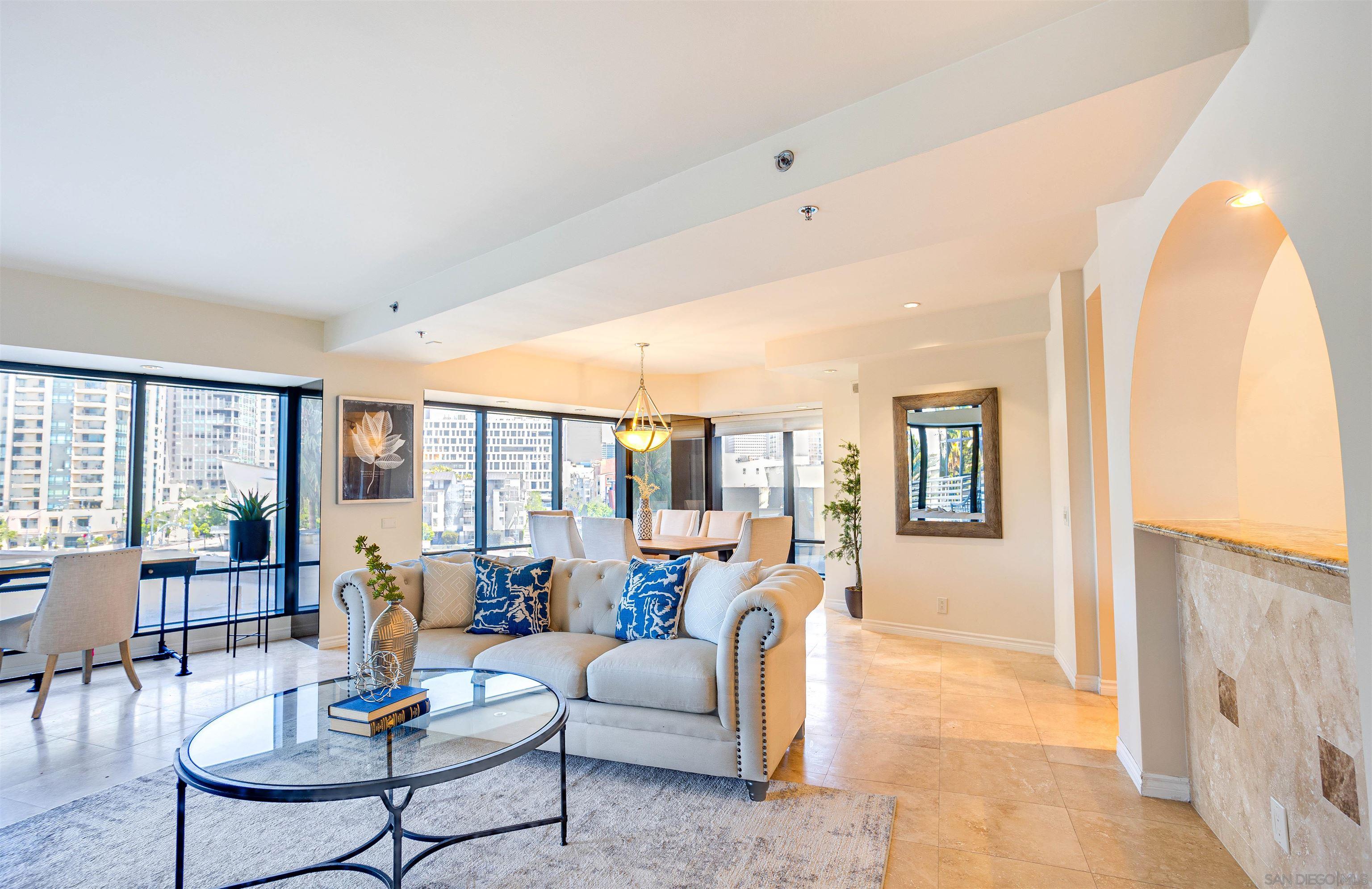 100 Harbor Drive, Unit 505 San Diego, CA 92101 - Photo 4 of 33 a living room with furniture and large windows