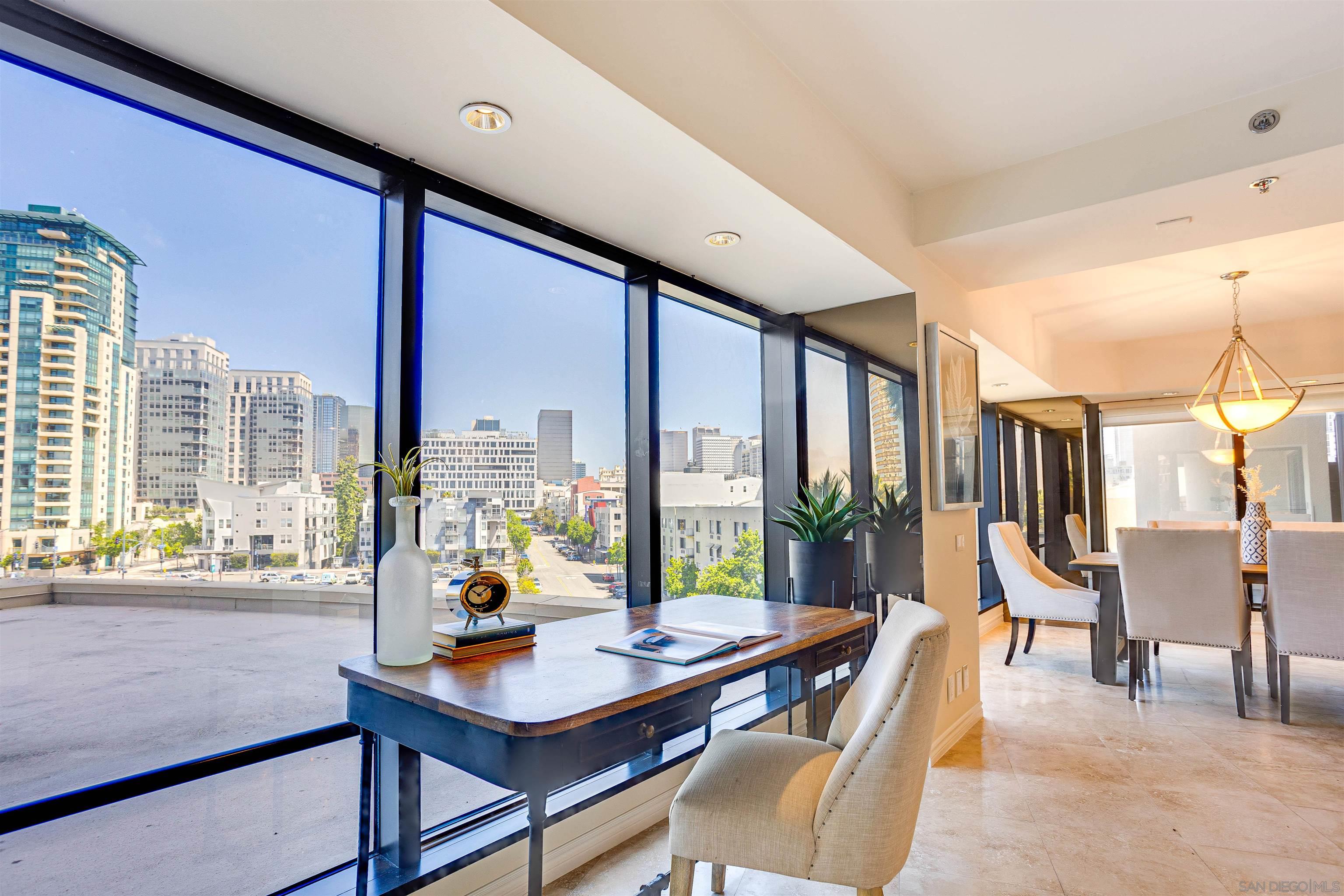 100 Harbor Drive, Unit 505 San Diego, CA 92101 - Photo 6 of 33 a living room with furniture and large windows