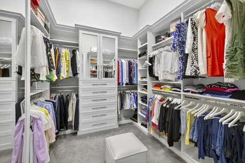 an aerial view of residential houses with outdoor space and swimming pool