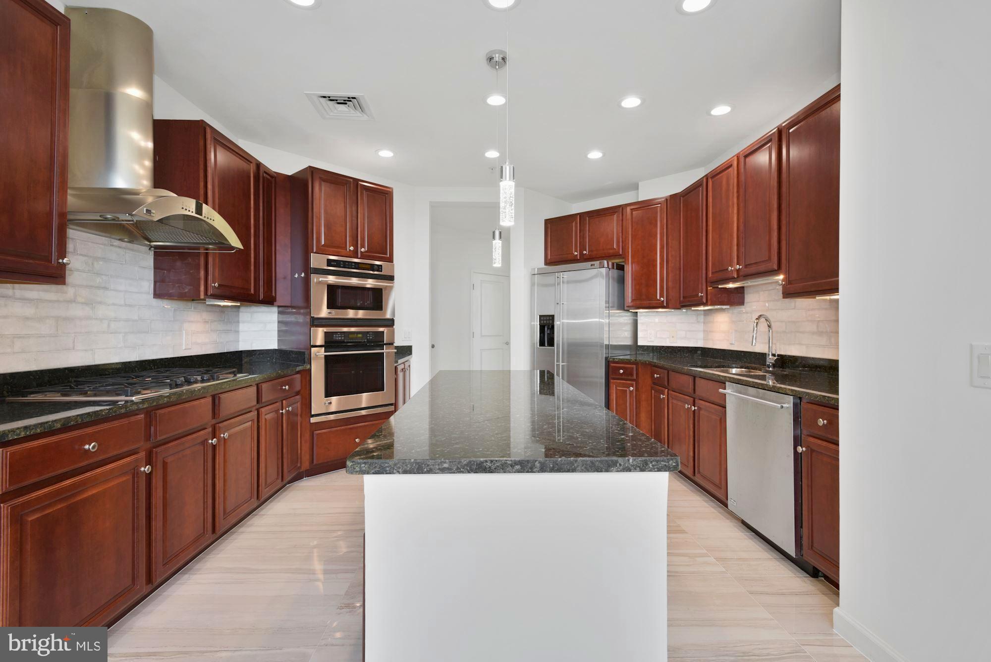 1830 Fountain Drive, Unit 1501 Reston, VA 20190 - Photo 23 of 62 Kitchen with Island
