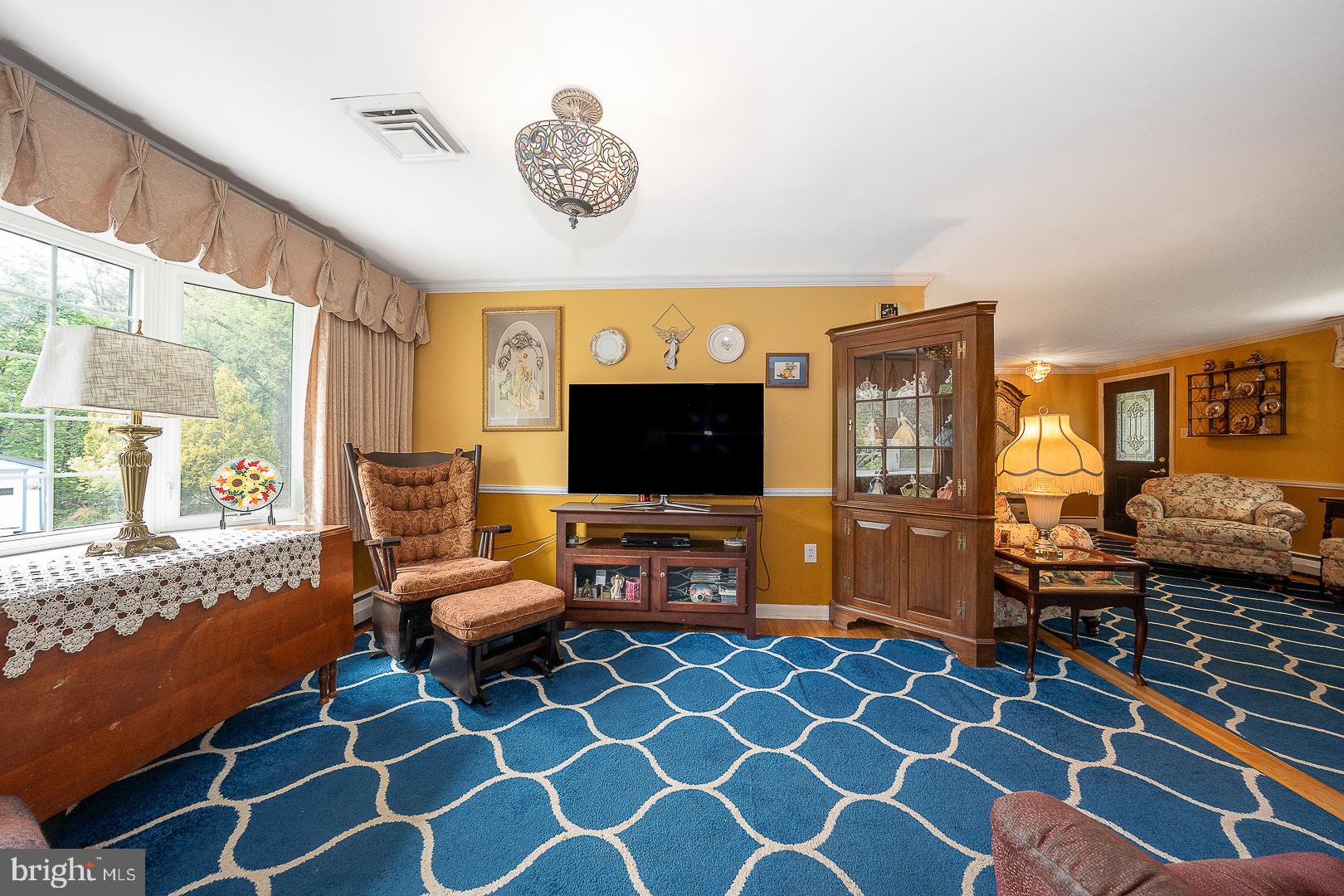 9 Buckwalter Road Audubon, PA 19403 - Photo 11 of 35 a living room with furniture and a flat screen tv