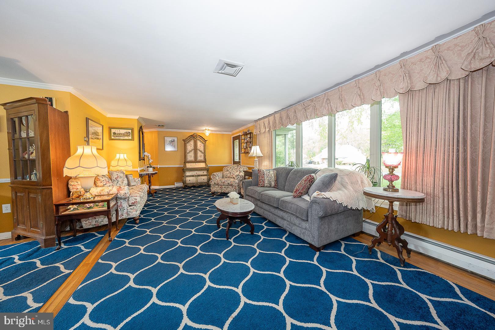 9 Buckwalter Road Audubon, PA 19403 - Photo 12 of 35 a living room with furniture and a floor to ceiling window