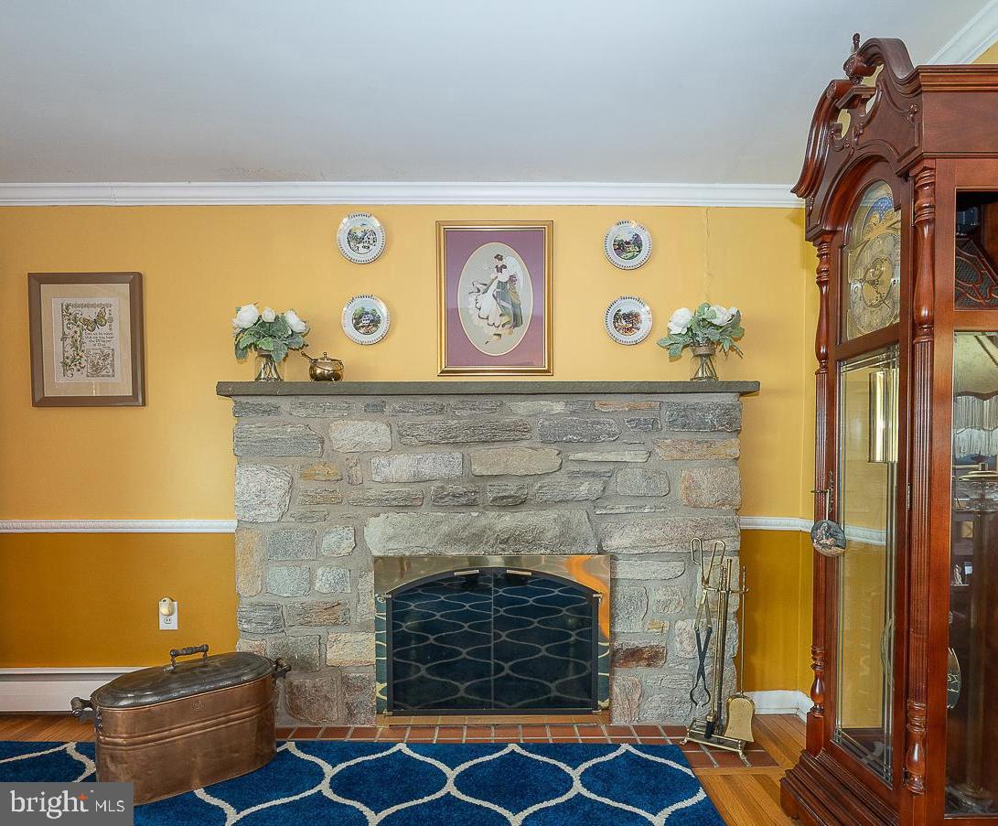 9 Buckwalter Road Audubon, PA 19403 - Photo 13 of 35 a brick building with a fireplace and wooden floor