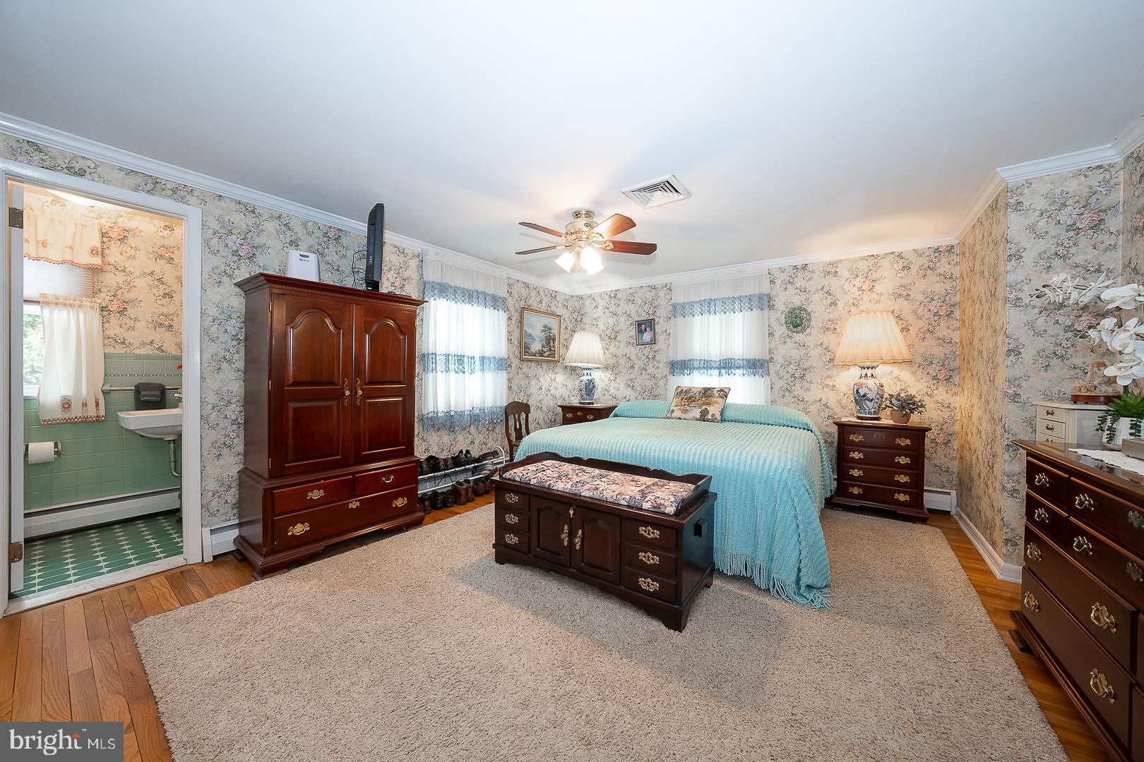 9 Buckwalter Road Audubon, PA 19403 - Photo 15 of 35 a bedroom with a bed dresser and a flat tv screen