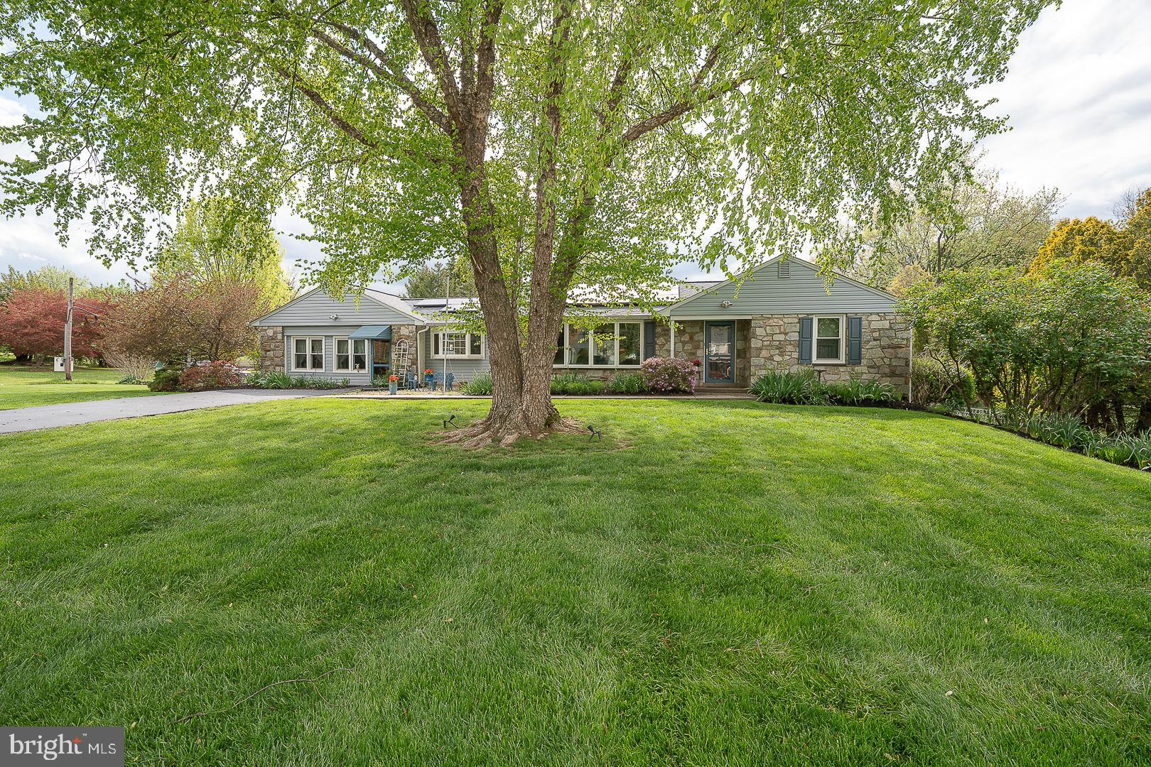 9 Buckwalter Road Audubon, PA 19403 - Photo 2 of 35 a view of a house with a big yard and large trees