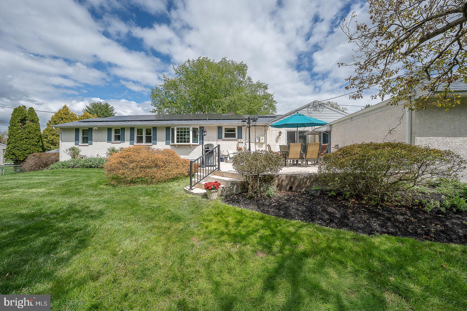 9 Buckwalter Road Audubon, PA 19403 - Photo 26 of 35 a view of a house with a yard and potted plants