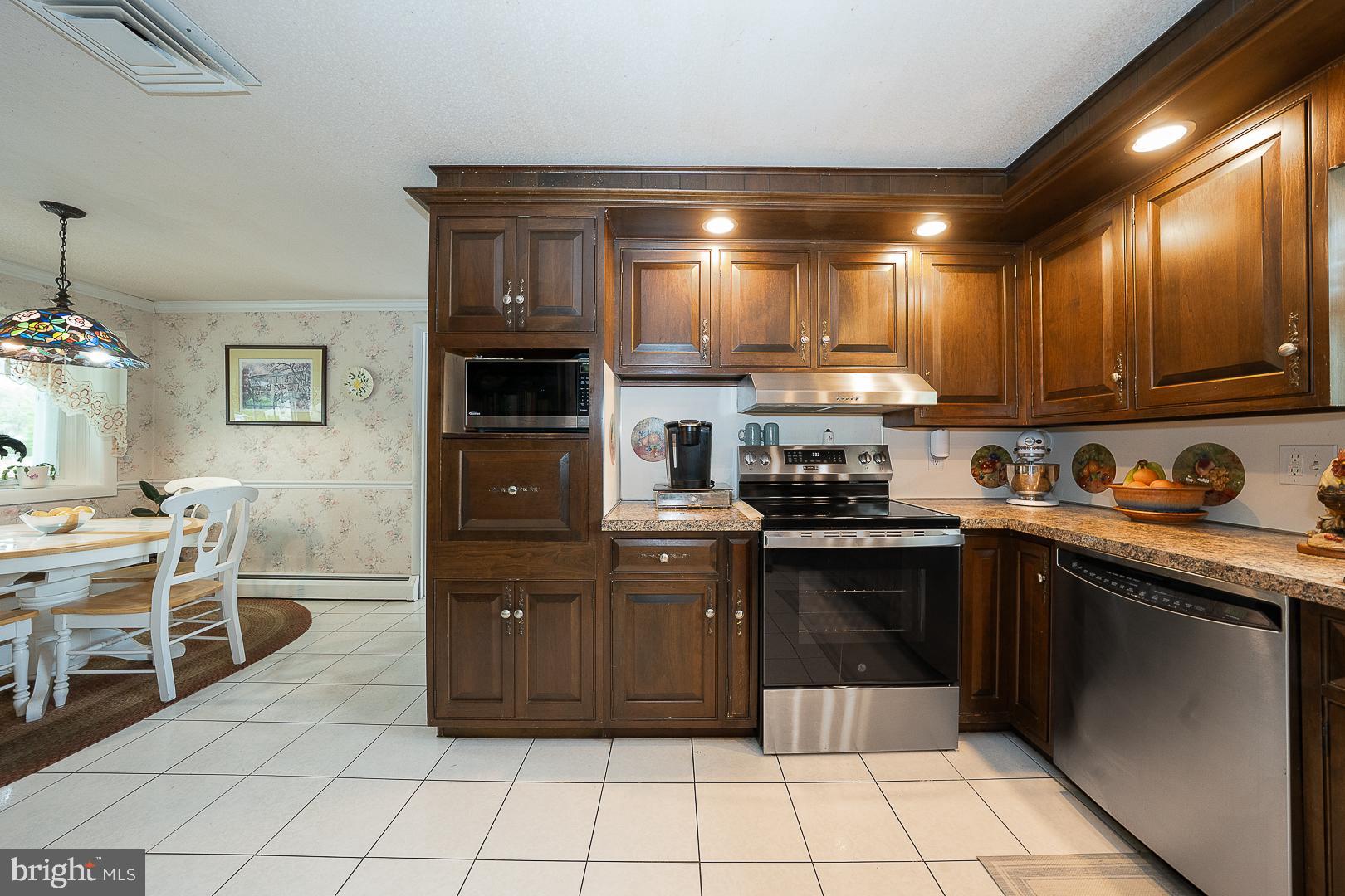 9 Buckwalter Road Audubon, PA 19403 - Photo 7 of 35 a kitchen with a sink and cabinets