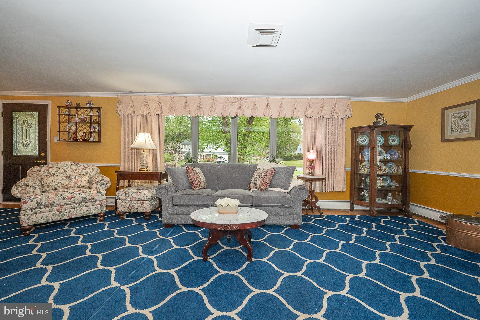 9 Buckwalter Road Audubon, PA 19403 - Photo 10 of 35 a living room with furniture and a rug