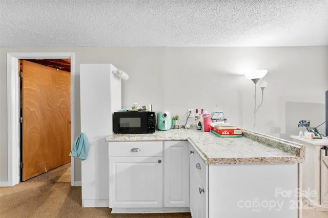 a utility room with sink dryer and washer