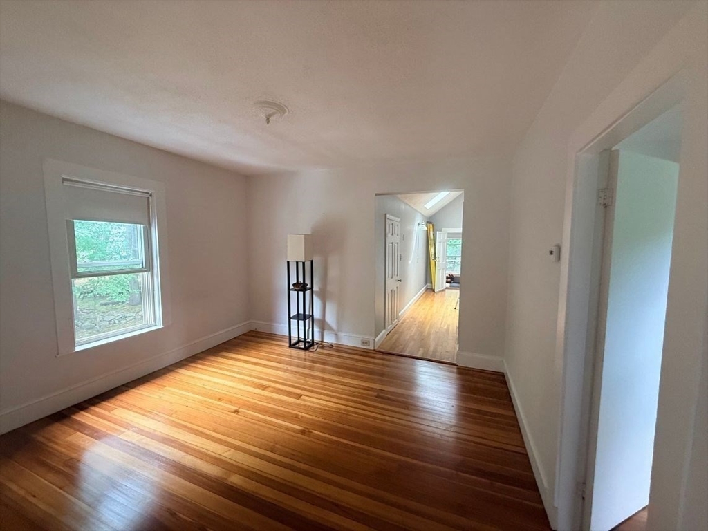 0 Cedar Street, Unit 2 Dedham, MA 02026 - Photo 11 of 11 wooden floor in an empty room with a window