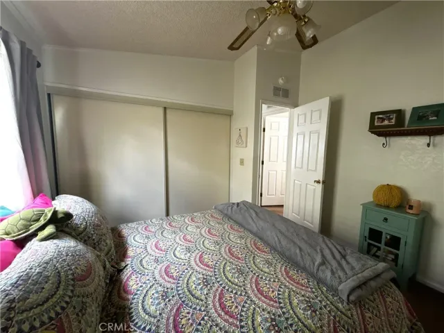 a bedroom with a bed and a mirror