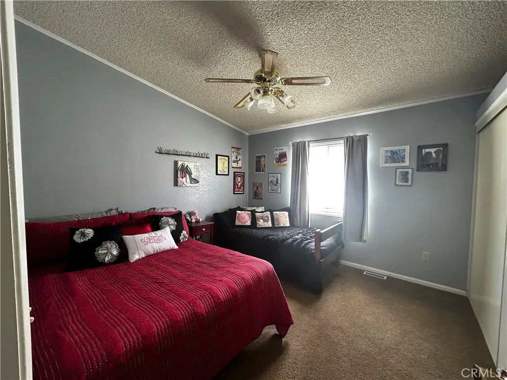 2 Havasu Lake Road, Unit 2 Needles, CA 92363 - Photo 9 of 17 a bedroom with a bed and window