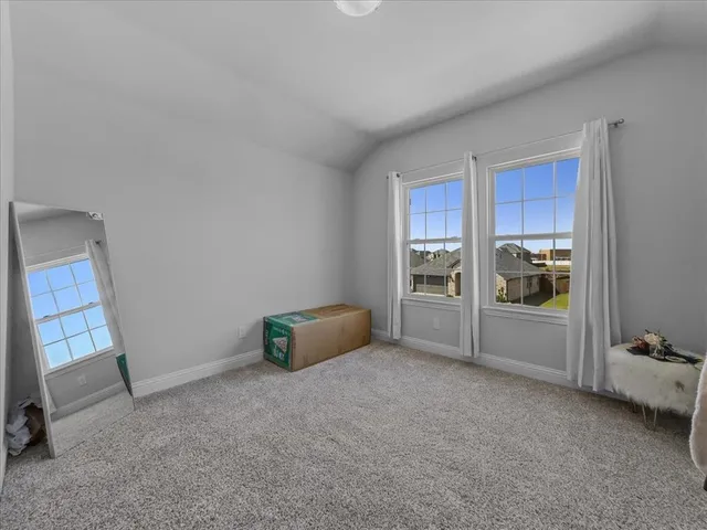 a view of a livingroom with furniture and a window