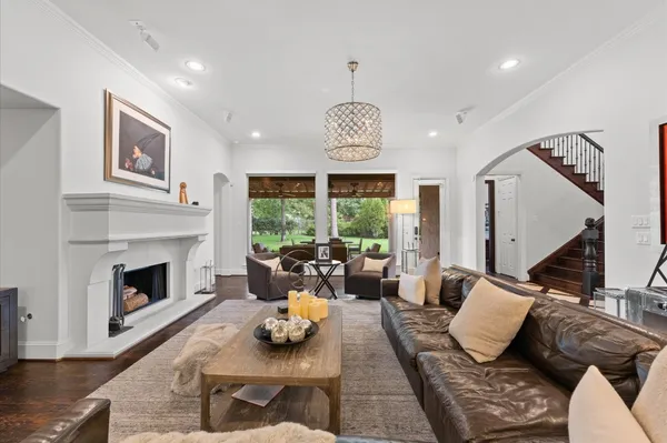 a living room with furniture fireplace and window
