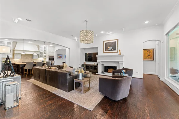 a living room with fireplace furniture and a flat screen tv
