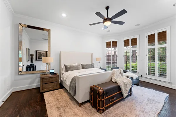 a bedroom with a large bed and a large window