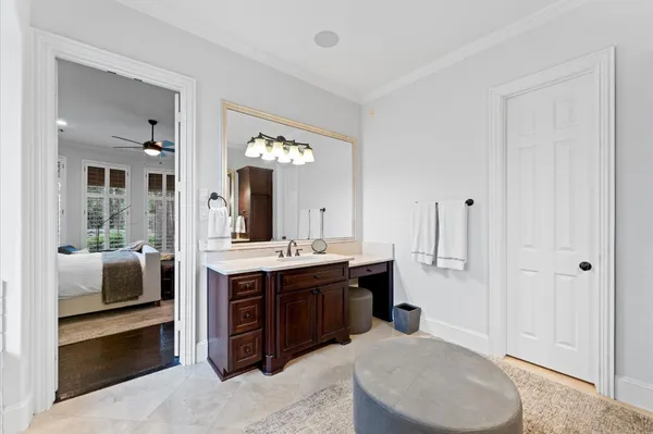 a spacious bathroom with a double vanity sink and a mirror