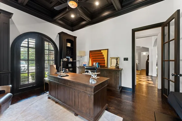 a dining hall with stainless steel appliances granite countertop a stove and a large window