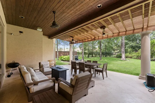 a patio with yard table and chairs