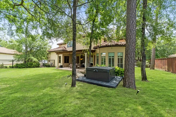a front view of a house with a garden and porch