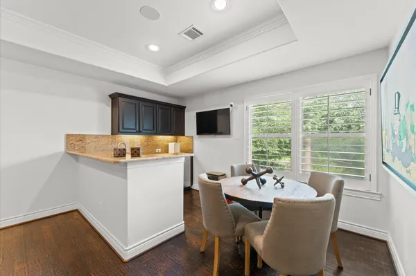 a kitchen with granite countertop cabinets sink and a granite counter top