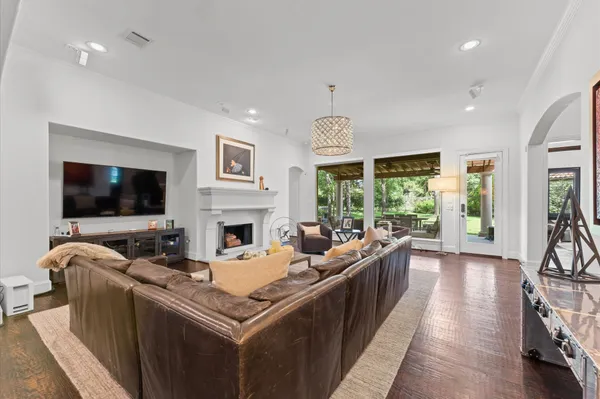 a living room with furniture fireplace and flat screen tv