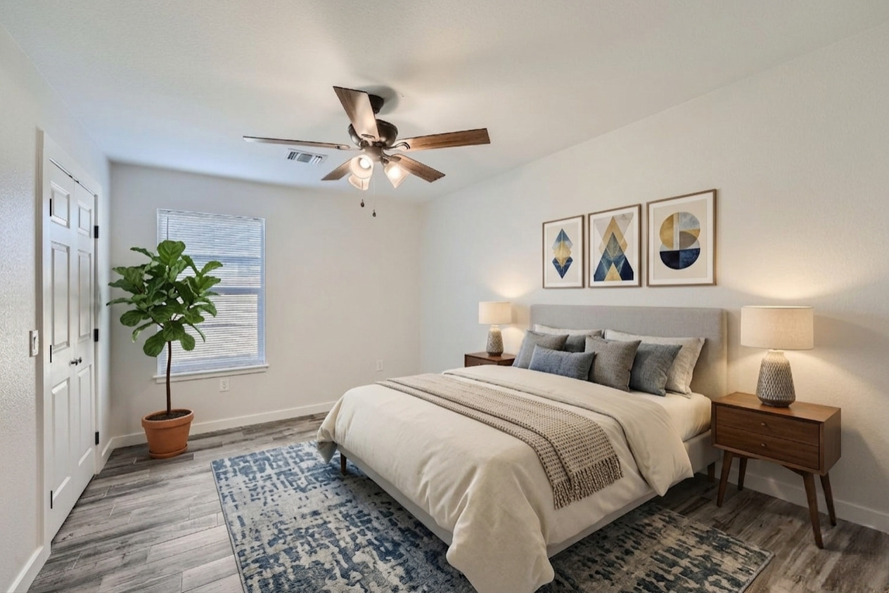 111 Fisher Street, Unit A & B Elgin, TX 78621 - Photo 11 of 13 a bedroom with a bed and a potted plant