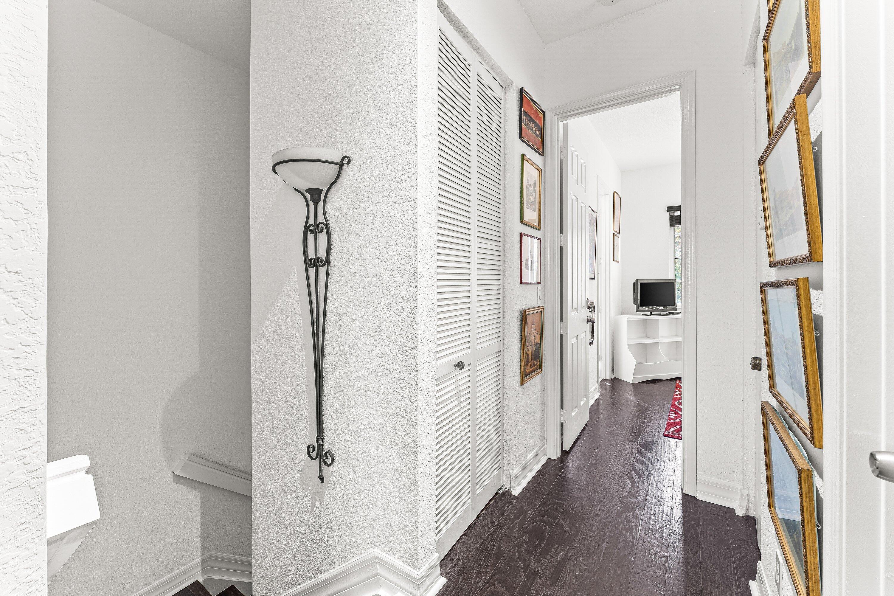 179 Edenberry Avenue Jupiter, FL 33458 - Photo 16 of 21 Hallway with Wood Flooring