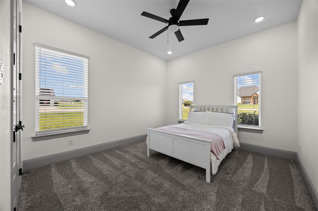6317 Vega Road Godley, TX 76044 - Photo 22 of 27 a spacious bedroom with a bed and a window